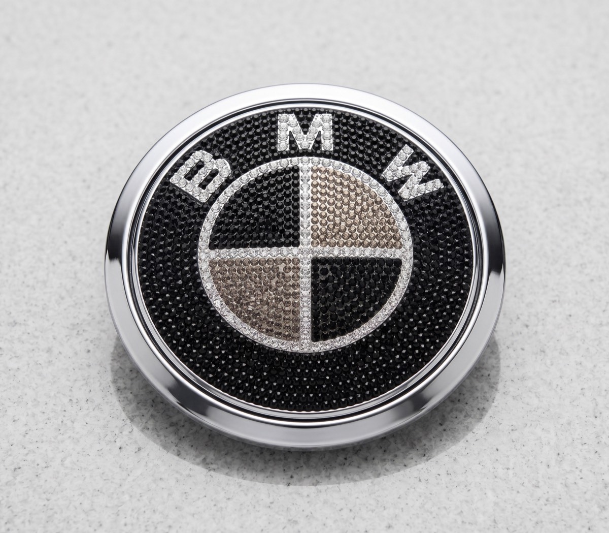 BMW emblem accessory displayed on a clean neutral background